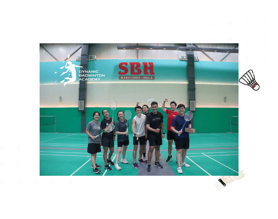Badminton Coach Demonstrating Technique To Corporate Participants